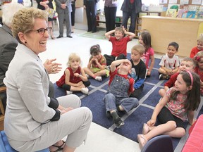 Ontario Premier Kathleen Wynne visits a combined junior and senior kindergarten class in Ecole Sir John A. Macdonald Public School Monday afternoon. She was there to help the school celebrate the completion of its first year.
Michael Lea The Whig-Standard