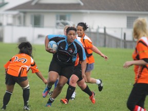 Latoya Farrell of Fort McMurray Knights runs the ball just outside the try zone in the women’s Knights home opener against Lloydminster Saturday afternoon at the Westwood rugby pitch. TREVOR HOWLETT/TODAY STAFF