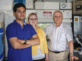 Luis Alberto Arvizu Gutierrez, Laura Marchese-Smith, and Dr. Myron Szewczuk believe they might have found a possible link to a cure for types of pancreatic cancer. 
Sam Koebrich for The Whig-Standard