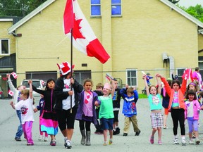 Students in grades 1 and 2 at Cornwall’s École Élémentaire Catholique Sainte-Thérèse walk with project co-ordinator, Carol Viau, during recess. The students participated in a project to learn about Canada by walking about half the distance of Canada without leaving the city.
Erika Glasberg staff photo
