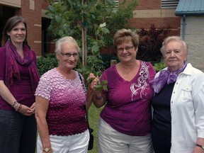 The Elgin Elder Abuse Resource Committee (EEARC) planted a red maple tree Saturday at the St. Thomas Seniors Centre to commemorate World Elder Abuse Awareness Day. Pictured with the tree from left - committee chairpman Tobi Maniacco; volunteer Evelyn Henderson; committee coordinator Bonnie Rowe; and Times-Journal seniors issues columnist Dorothy Wilson.