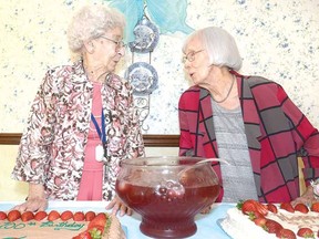 Theo Gilliland, left, and Chris Fisher share the spotlight at a celebration marking their 100th birthdays at Anne Hathaway Residence Monday. (SCOTT WISHART The Beacon Herald)