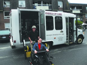 Volunteer driver John Deir helps Brian Patterson onto the Wheels of Care van.     Wayne Lowrie - Gananoque Reporter