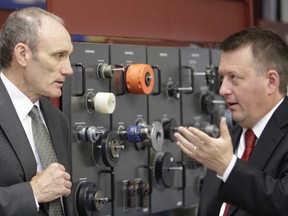 Colin Kirkwood, dean of Environment and Technology at Sault College and David Roland Finley, dean of Business and Engineering at Lake Superior State University share a few words after a news conference at Sault College announcing their ongoing partnership to ensure a smooth transition for college students from the Electrical Engineering Technology to an Electrical Engineering Technology Science Degree at LSSU. The cross-border agreement aims to improve the labour market participation of those in the field of Electrical Engineering Technology.