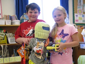 Students Ryan Watson and Sophie Twolan from Ripley-Huron Community School stand with the transformed Nobody doll. (AVERY LAFORTUNE/KINCARDINE NEWS CO-OP STUDENT)