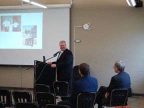 John Spencer speaks to a crowd at the Kerry Vickar Centre about the Church of Jesus Christ of Latter- day Saints on Thursday, June 13