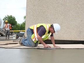 Greg Wiseman Melfort Journal
Workers finish sidewalk work at MacLeod Ave. and Main St.