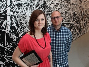 Modern Fuel's Megan McNeil, the general director and Kevin Rodgers, the artistic director in their Queen Street studio, in front of art by Charles Campbell. The art gallery will be moving to the J.K. Tett Centre next year.
Ian MacAlpine The Whig-Standard