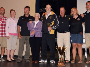 Bill Slimmon Memorial Award winner Ray Hanley (centre) is joined by Gladys Slimmon and  Tom Gauthier and current THS coaches that Hanley has taught over the years, Brian Meindl, Tara Feeney, Mark Dolton, Jennifer Reid and Josh Chambers.