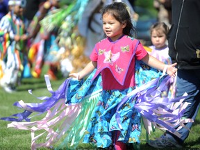 Kyra Lawrence, 3, dances as she takes part in her first mini powwow at the Aamjiwnaang Binoojiinyag Kino Maagewagamgoons daycare Tuesday on the Aamjiwnaang First Nation reserve. The event was the official "coming out" for the daycare's Regalia Making and Tiny Tots Dance Group � eight children. About 70 people attended the annual event, preceeding the 52nd annual Aamjiwnaang Competition Powwow this weekend. TYLER KULA/ THE OBSERVER/ QMI AGENCY