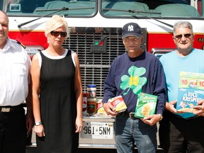 Expect to hear sirens as Timmins firefighters hit the streets on Sunday afternoon for their annual food bank collection. Firefighters from all stations will take their big red trucks out in their respective areas from noon to 4 p.m. On hand to promote Sunday’s drive were, from left, Deputy Fire Chief Gerry Sabourin, food drive volunteer Cheryl Daly of Girones Lawyers , Timmins Food Bank president Rick Young and South Porcupine Food Bank Richard Bouvier.