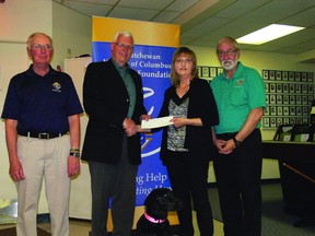 Gail Maki receives a donation cheque from the Knights of Columbus Charitable Foundation. From left: Ronald Sartzky, Harvey Grenatier, Echo, Gail Maki and Gilles J. Doiron.