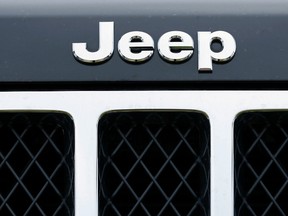 The logo on the front of a Jeep vehicle is shown at a Chrysler dealership in Carlsbad, California April 29, 2013. (REUTERS/Mike Blake)