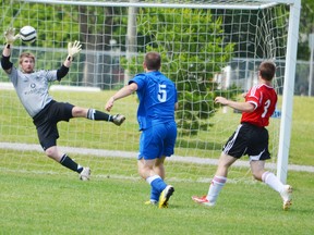 Contributed Photo
Jake Mitton of the Simcoe FC Crew makes the Chatham keeper work hard during a WOSL men's third division game Sunday in Simcoe.
