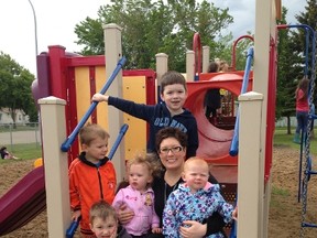 Dayhome owner Sara Johnston poses for a snapshot with the children she cares for. Johnston recently received the provincial Award of Excellence for the category Rural Family Day Home.