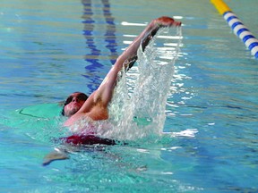 UCSC swimmer Collin Reynolds works on his backstroke Tuesday at the Y. One of the club's veteran swimmers, Reynolds is one of 195 total athletes from across Eastern Ontario expected to take part this Sunday in the annual Brockville Splash meet. (STEVE PETTIBONE The Recorder and Times)