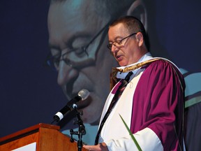 Author Eric Walters addresses the convocation ceremony on Tuesday for graduates of the Laurier-Nipissing concurrent education program.(Michelle Ruby, The Expositor)