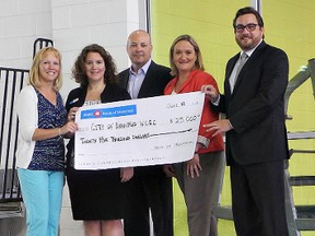 BMO Bank of Montreal donates $25,000 for a clock and timing system for the new pool at the Wayne Gretzky Sports Centre. In the photo are: Sandy Jackson (left), the city's acting director of recreation, Tara Conway, BMO personal banking manager for Brantford; Rick Jaques,  BMO Hamilton area vice-president; Suzanne Paulins, BMO Henry and Wayne Gretzky Parkway branch manager, and Mayor Chris Friel. (HUGO RODRIGUES, The Expositor)