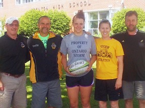 Trenton High Tigers senior girls rugby team member Brittney Whiting (centre) has been named to the Rugby Ontario U18 women's side that will play at the Rugby National Championships in Vancouver, B.C. in August. Joining Whiting are, from the left: retired THS teacher and coach Duncan Armstrong and THS rugby coaches Brian Meindl, Tara Feeney and Mark Dolton.