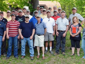 Veterinarians from across much of Ontario and one from Quebec attended the 34th Prodan veterinary conference in early June. The group paid tribute to Dr. Dennis Prodan, a long-time Elliot Lake veterinarian, who died last summer. They were joined by Carole Prodan second woman from the right, and two clinic staff members at the Elliot Lake Veterinary Clinic.			        Photo by KEVIN McSHEFFREY/THE STANDARD/QMI AGENCY