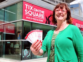 Tix on the Square general manager Judy Stelck poses with a handful of Edmonton International Jazz Festival Tickets at Churchill Square on Monday, TREVOR ROBB Edmonton Examiner
