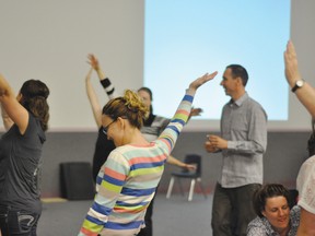 Vince Gowmon explains to a group of parents how to play.