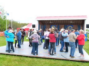 The weather didn’t really seem like music festival weather this past weekend but that didn’t deter music fans from dancing up a storm (just a figure of speech - I think) all weekend long at the Lions Old Time Music Festival at the Cummings Lake Campground just north of the Town of Fairview. The band John Roy was on stage at the time.