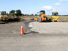 The Ontario Ministry of Labour has issued two orders under the Occupational Health and Safety Act following a workplace injury at 21118 Base Line in Harwich Township at about 12:45 p.m. Friday. A man was taken to Chatham-Kent Health Alliance with two broken legs and later airlifted to Victoria Hospital in London. The general contractor RES Canada was issued an order to provide a signaler at the site when vehicles are backing up. A subcontractor, Clarke Construction Ltd. was also issued an order to use signals when turning a vehicle. The unidentified victim was injured when a transport truck pulling a trailer carrying a bulldozer backed into him. PHOTO TAKEN MULL, On., Wednesday June 19, 2013 VICKI GOUGH/ THE CHATHAM DAILY NEWS/ QMI AGENCY