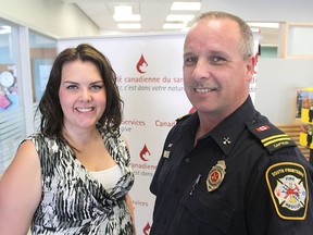 Valerie Watts, community development co-ordinator with Canadian Blood Services, and Capt. Don MacMillan-Leisk with South Frontenac Fire & Rescue are promoting the June 28 kick-off at the K-Rock Centre of the Sirens For Life blood donation event, where emergency personnel roll up their sleeves to donate blood.
Michael Lea The Whig-Standard