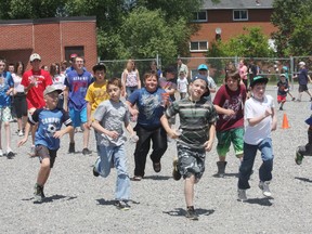 More than 300 students from St. Charles Catholic Elementary School in Chelmsford participate in the Jonathan Hetu Walk for Cancer event on Wednesday, June 19, 2013. Money raised from the event will go to the Northern Ontario Families of Children With Cancer. See video at www.thesudburystar.com JOHN LAPPA/THE SUDBURY STAR/QMI AGENCY