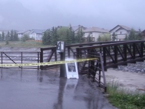 The pedestrian bridge over Cougar Creek, located midpoint between Elk Run Boulevard and the Trans-Canada Highway was closed around 9 p.m. Wednesday. Russ Ullyot/ Canmore Leader/ QMI Agency