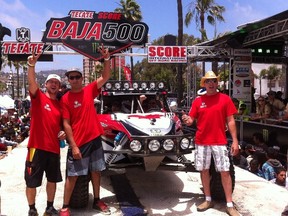 From left to right: Lee Mundt, Mike Ferguson, Lyle Bask (in car), Don Boucher enjoy the Contingency event at this years Tecate SCORE Baja 500 earlier this month in Ensenada, Baja California, Mexico.