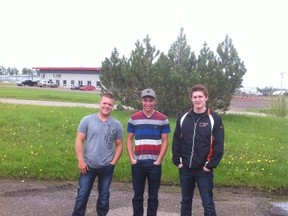 From left to right: Cory Cox, Steven Kover, and Tanner Bjorklund pose for a photo.