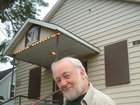 Harry Houston, president of Sault Theatre Workshop when this photo was taken in 2006, welcomes theatre-goers to the group's Studio Theatre on Pittsburg Avenue.