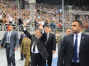 Egyptian President Mohamed Morsi waves to supporters at a rally organized earlier this week by the Muslim Brotherhood. As the conflict in Syria threatens to widen, Morsi announced Egypt was severing diplomatic ties with Damascus and demanded that the Hezbollah fighters supporting Syrian President Bashar al-Assad leave the country.