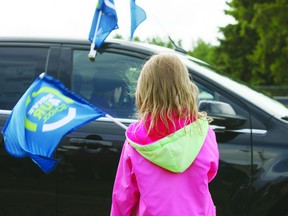 Kids play with flags at the Bruderheim School Drive 4 UR School event put on by Ford Canada. The event was held to help raise money for a playground at the elementary school. Photo by Aaron Taylor.
