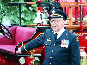Walter Thomas, 90, stands next to an old fire truck last Saturday, when Fort Saskatchewan’s fire hall was named in his honour. Photo by Aaron Taylor.