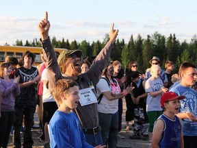 Pastor Bob (center) of the Glad Tidings Pentecostal Church was singing along with the the youth and the band that played before the Tuff Mudder began.