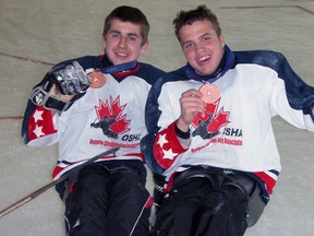 Tom Gabriel, left, and Dylan Kett competed for the Western Ontario team in sledge hockey at the Ontario Parasport Games in Kingston earlier in June. The duo finished with the bronze medals in the three-team tournament. SUBMITTED PHOTO/THE OBSERVER/QMI AGENCY