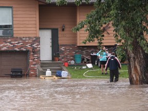 KEVIN RUSHWORTH HIGH RIVER TIMES/QMI AGENCY. After the Highwood River burst its banks early this morning, half the town was under water by mid morning. The Town of High River started issuing evacuations to the Bob Snodgrass Recreation Centre and then the Highwood High School. Both of those evacuation points have been since evacuated, with residents heading south to Nanton or Aldersyde.