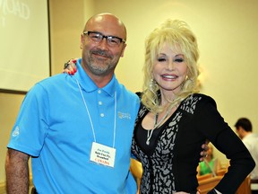 Ask and you might receive: Brantford's Joe Persia asked superstar Dolly Parton for a hug and got one while at a conference in Pigeon Forge, Tenn. (Submitted Photo)