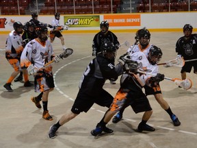 The Owen Sound Garb & Gear NorthStars Henry Fryday is checked by Orangeville's Tyler McCarthy in the Northmen's 22-6 win on Thursday in Ontario Lacrosse Association Junior B Series action in Owen Sound.