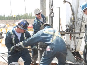Workers operate an oil rig at the Cenovus Christina Lake oilsands facility near Lac La Biche, Alta. Changes to the Temporary Foreign Workers prrgram will allow skill foreign labourers to apply for permanent residency without the consent of their employers. VINCENT MCDERMOTT/TODAY FILE PHOTO