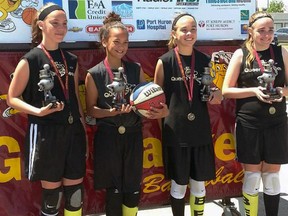 The Queen bees three-on-three basketball team that finished second at the Gus Macker tournament in Port Huron. Pictured are (left to right) Monika Vowel, J.J. Kidd, Jordan Braekevelt, and Sarah Woods. SUBMITTED PHOTO/THE OBSERVER/QMI AGENCY