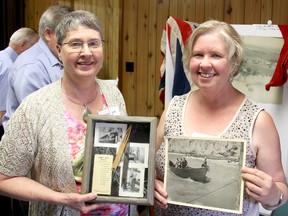 Cousins Jane Rumble, left, and Heather Crewe enjoyed talking about growing up in the hamlet of Port Crewe, Ont., during a reunion held Saturday, June 15, 2013, in Merlin, Ont. Their great grandfather Alexander Crewe, along with his brothers Dexter and Milton Crewe, founded the Crewe Brothers Fishery, in 1904, in the once-thriving hamlet. ELLWOOD SHREVE/ THE CHATHAM DAILY NEWS/ QMI AGENCY