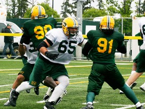 The Grove’s Simeon Rottier (65) goes up against defensive end Howard Marcus during the Esks workout at Fuhr Sports Park on June 16. - Gord Montgomery, Reporter/Examiner