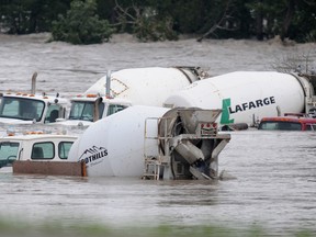 Cement trucks sit submerged at Anderson Road and Deerfoot Trial in SE Calgary, Alta. on June 21, 2013,  completely under water after massive and destructive flooding of the Bow River. River
Stuart Dryden/Calgary Sun/QMI Agency