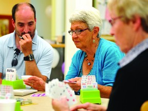A little perplexed, Brockville Recorder and Times sports editor Steve Pettibone tries to gain some understanding of the complexities of duplicate bridge during The Longest Day tournament at the First Presbyterian Church on Friday. (DARCY CHEEK The Recorder and Times)