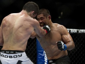 Mark Munoz (right) and Demian Maia exchange punches during UFC 131 at Rogers Arena in Vancouver, June, 11, 2011. (RICHARD LAM/QMI Agency)