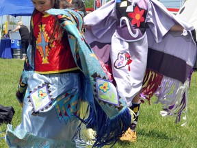 Danis Sackaney, left, and Melanie Breault perform some traditional Aboriginal dancing, backed up by the sounds of the Whitestone Cree Singers at Hollinger Park for National Aboriginal Day.